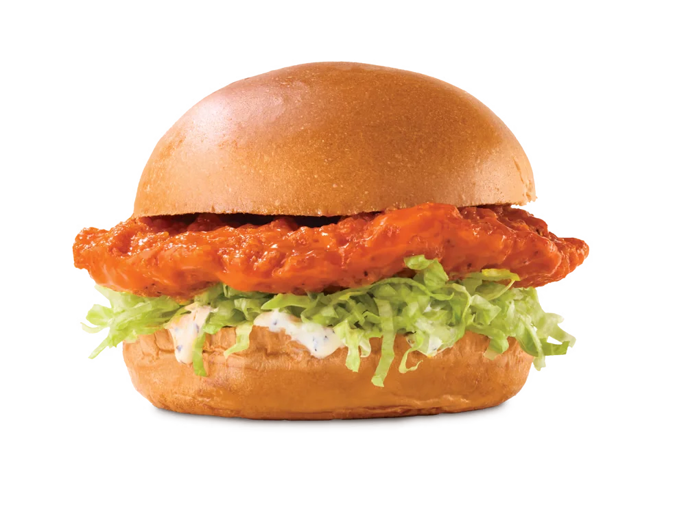 Arby's Buffalo Crispy Chicken Sandwich with spicy buffalo sauce, lettuce, and ranch dressing on a toasted brioche bun.