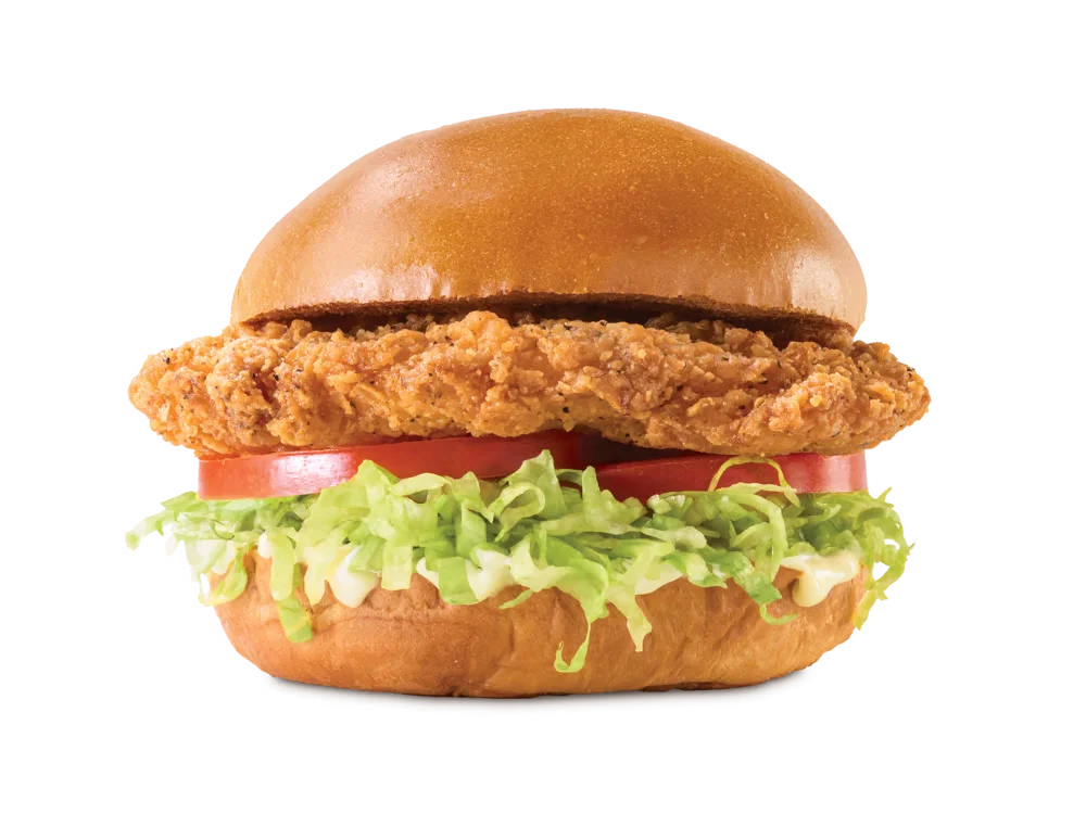 Arby's Classic Crispy Chicken Sandwich with lettuce, tomato, and mayonnaise on a toasted brioche bun.