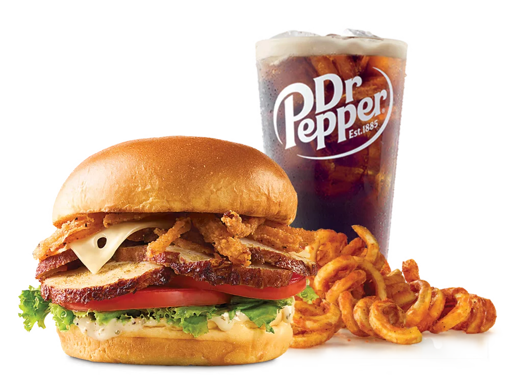 Arby's Deep Fried Turkey Gobbler Sandwich with crispy onions, Swiss cheese, lettuce, tomato, and herb spread on a toasted brioche bun, served with curly fries and a drink.