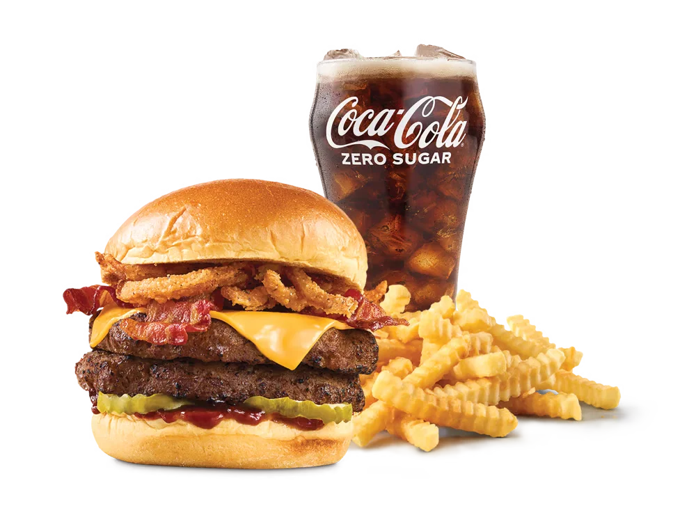 Arby's Double BBQ Bacon Burger with two beef patties, crispy onions, bacon, American cheese, pickles, and smoky BBQ sauce on a toasted brioche bun, served with medium curly fries and a medium soft drink.