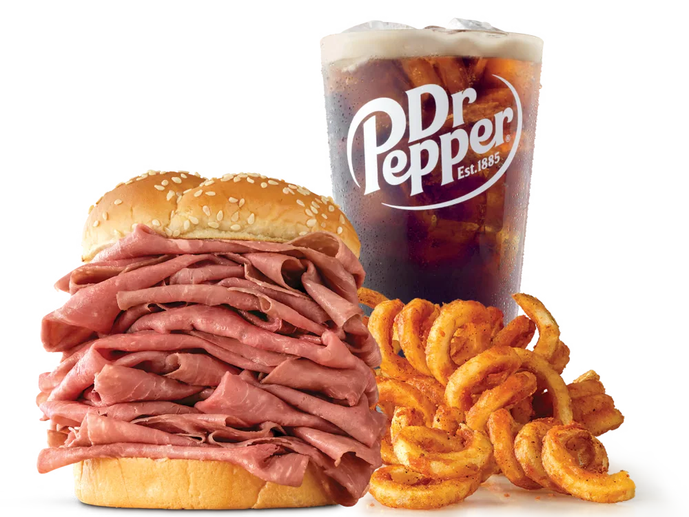 Arby's Half Pound Roast Beef Sandwich with thinly sliced roast beef on a sesame seed bun, served with medium curly fries and a medium soft drink.